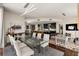 Elegant dining room with a glass-top table, seating for six, and view of the kitchen area at 3325 Piedmont Ne Rd # 2006, Atlanta, GA 30305