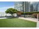 Modern dog park with artificial turf and lush landscaping, perfect for pets at 3325 Piedmont Ne Rd # 2006, Atlanta, GA 30305