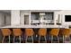 Modern kitchen with an island, stainless steel appliances, dark cabinets, and six counter chairs at 3325 Piedmont Ne Rd # 2006, Atlanta, GA 30305