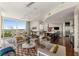 Open-concept living and kitchen area with hardwood floors and lots of natural light at 3325 Piedmont Ne Rd # 2006, Atlanta, GA 30305