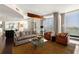 Bright, open living space featuring modern furnishings, city views, and a well-equipped kitchen at 3325 Piedmont Ne Rd # 2006, Atlanta, GA 30305