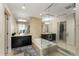 The main bathroom includes a glass shower, separate tub, and dual vanities at 3325 Piedmont Ne Rd # 2006, Atlanta, GA 30305