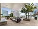 Stylish outdoor patio area with comfortable seating, dining tables, and city views with planters at 3325 Piedmont Ne Rd # 2006, Atlanta, GA 30305
