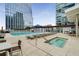 Luxury rooftop swimming pool and hot tub with comfortable lounge chairs and city views at 3325 Piedmont Ne Rd # 2006, Atlanta, GA 30305