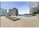 Stunning rooftop pool deck featuring chaise lounges and amazing city views at 3325 Piedmont Ne Rd # 2006, Atlanta, GA 30305