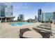 Amazing rooftop pool area with city views, lounge chairs, and umbrellas for relaxation at 3325 Piedmont Ne Rd # 2006, Atlanta, GA 30305