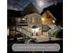 Backyard resort featuring a well-lit patio, stairs leading to upper levels, and an inviting atmosphere at 1417 Doe Valley Dr, Lithonia, GA 30058
