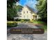 Elegant two-story home with lush landscaping and a circular driveway on a 1.9 acre estate at 1417 Doe Valley Dr, Lithonia, GA 30058