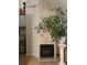 Living room fireplace with stone surround, decorative plant, and neutral decor at 1417 Doe Valley Dr, Lithonia, GA 30058
