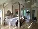 Spacious bedroom featuring a four-poster bed, neutral colors, and natural light at 1417 Doe Valley Dr, Lithonia, GA 30058