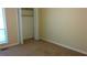 A simple bedroom featuring carpet and an open closet at 2297 Horseshoe Bend Sw Rd, Marietta, GA 30064