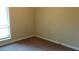 A neutral bedroom featuring a window with blinds and carpeting at 2297 Horseshoe Bend Sw Rd, Marietta, GA 30064