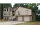 Charming home featuring a two-car garage and beautiful architectural details at 2297 Horseshoe Bend Sw Rd, Marietta, GA 30064