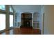 Cozy living room with a stone fireplace, built-in shelves, and large windows at 2297 Horseshoe Bend Sw Rd, Marietta, GA 30064