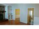 Living room featuring a fireplace, built-in shelves, and open doorway at 2297 Horseshoe Bend Sw Rd, Marietta, GA 30064