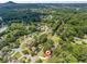Neighborhood aerial view featuring mature landscaping, winding roads, and well-maintained homes at 579 Chapman Dr, Marietta, GA 30066