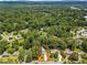 An aerial view showcasing the home's location in a lush, green neighborhood with mature trees at 579 Chapman Dr, Marietta, GA 30066