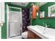 Colorful bathroom featuring a shower, cabinet and modern sink at 579 Chapman Dr, Marietta, GA 30066