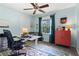 Another stylish bedroom featuring colorful decor, fan and carpeted floor at 579 Chapman Dr, Marietta, GA 30066