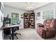 Bright bedroom offering chair, desk, fan, and carpeted floor at 579 Chapman Dr, Marietta, GA 30066