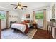 Cozy bedroom with large windows, wood floors, and tasteful decor at 579 Chapman Dr, Marietta, GA 30066