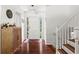 Welcoming foyer with hardwood floors, staircase, and stylish decor at 579 Chapman Dr, Marietta, GA 30066