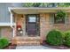 Inviting front entrance with brick steps, decorative plants, and detailed door at 579 Chapman Dr, Marietta, GA 30066