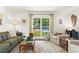 Bright living room features pool view, comfortable seating, and stylish decor at 579 Chapman Dr, Marietta, GA 30066