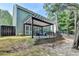 Green backyard with a patio, offers an inviting area for outdoor activities and relaxation at 335 Pintail Ct, Suwanee, GA 30024