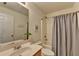 Bathroom featuring a shower/tub combo, toilet, sink, and vanity with a large mirror at 335 Pintail Ct, Suwanee, GA 30024