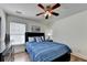 This bedroom has a black dresser, a large window with blinds, and a comfortable bed for a relaxing experience at 335 Pintail Ct, Suwanee, GA 30024