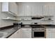 Bright kitchen features stainless steel appliances and granite countertops at 335 Pintail Ct, Suwanee, GA 30024
