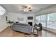 Cozy living room with hardwood floors, a fireplace, and comfortable seating, perfect for relaxing or entertaining guests at 335 Pintail Ct, Suwanee, GA 30024