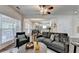 Bright living room area with hardwood flooring and a view into the dining area at 335 Pintail Ct, Suwanee, GA 30024