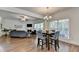 Spacious open concept living and dining area with hardwood floors and natural light at 335 Pintail Ct, Suwanee, GA 30024
