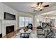 Living room with fire place opens to the dining area with abundant natural light at 335 Pintail Ct, Suwanee, GA 30024