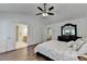 Large bedroom features wood floors, trey ceiling, and access to an ensuite bathroom at 335 Pintail Ct, Suwanee, GA 30024