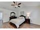 Spacious bedroom features wood floors, tray ceiling, and decorative furniture at 335 Pintail Ct, Suwanee, GA 30024