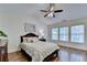 Serene primary bedroom with vaulted ceilings, wood floors, and natural light offers a relaxing retreat at 335 Pintail Ct, Suwanee, GA 30024