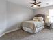 Cozy bedroom with neutral walls, carpet, a ceiling fan, and a window at 4765 Silver Leaf Dr, Cumming, GA 30040