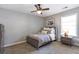 Bedroom with a bed, dresser and nightstand next to a window at 4765 Silver Leaf Dr, Cumming, GA 30040