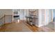 Upstairs hallway with hardwood floors leading to bedrooms and bathrooms at 4765 Silver Leaf Dr, Cumming, GA 30040