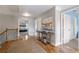 Bright upstairs hallway features hardwood floors and access to multiple bedrooms at 4765 Silver Leaf Dr, Cumming, GA 30040