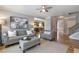 Open concept living room with natural light and hardwood floors, perfect for entertaining guests at 4765 Silver Leaf Dr, Cumming, GA 30040