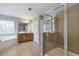Bathroom featuring a walk-in shower, corner bathtub, and a large vanity at 4765 Silver Leaf Dr, Cumming, GA 30040