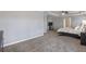 Spacious primary bedroom with a tray ceiling, carpet, and dark wood accents and a TV area at 4765 Silver Leaf Dr, Cumming, GA 30040