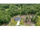 Aerial view of the home surrounded by lush trees and landscaping at 287 Flower Farm Dr, Acworth, GA 30101