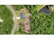 An aerial view of the house with its landscaped lot, surrounded by forest at 287 Flower Farm Dr, Acworth, GA 30101
