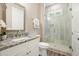 Stylish bathroom boasts granite countertops, white vanity, and a modern glass walk-in shower at 287 Flower Farm Dr, Acworth, GA 30101