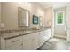 Bathroom featuring granite countertops, double sinks, and modern fixtures at 287 Flower Farm Dr, Acworth, GA 30101